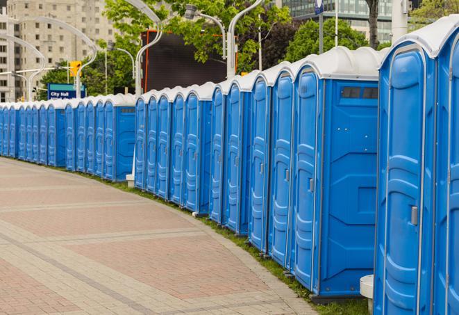 a row of sleek and modern portable restrooms at a special outdoor event in Arvada CO